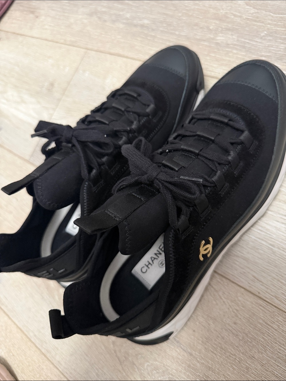 CHANEL Black Sneakers with Gold CC Accent